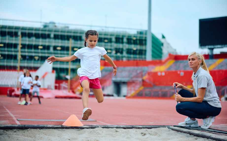 kid doing long jump